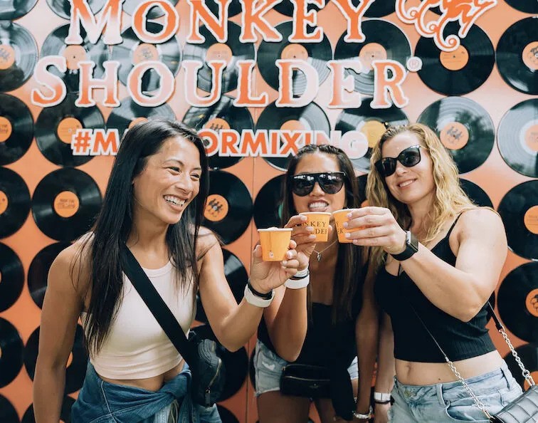 3 Women at DJ Skratch Bastid’s Toronto BBQ enjoying some Monkey Shoulder Whisky 