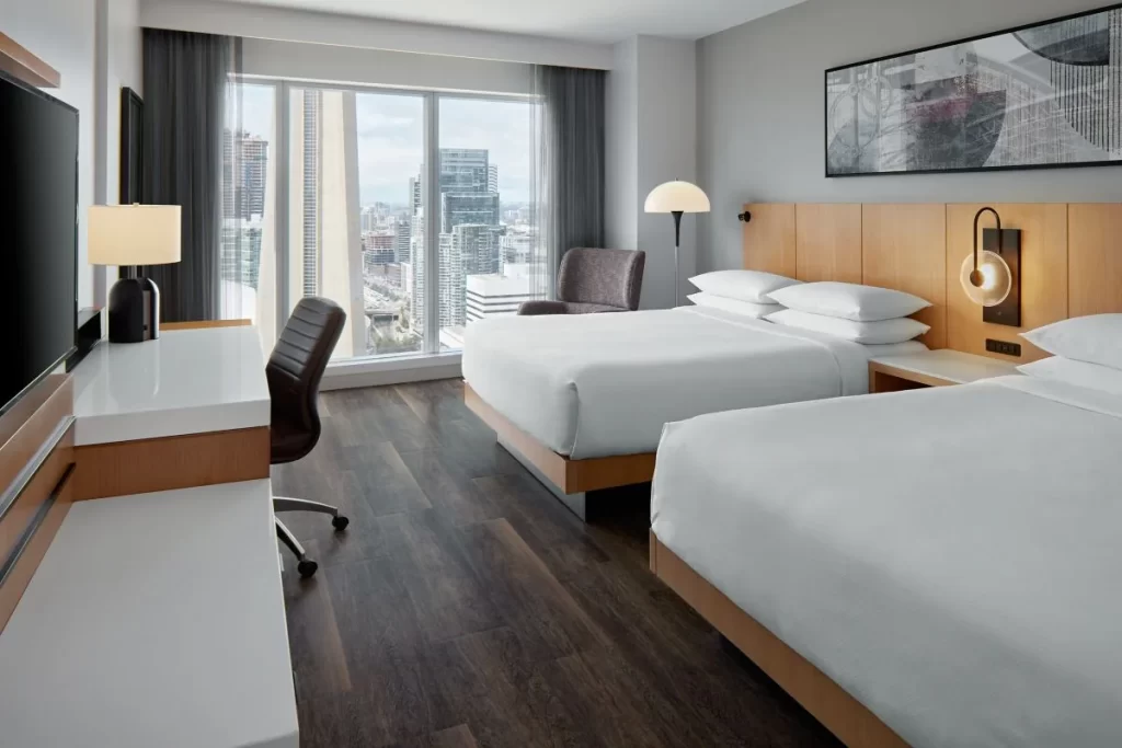Guest room at Delta Hotels by Marriott Toronto with floor-to-ceiling Toronto views