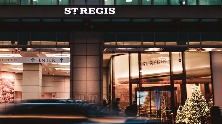 Street entrance of The St. Regis Toronto illuminated at night