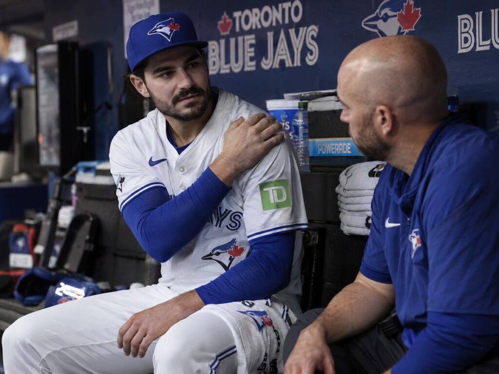 dylan-cease-shoulder-relief-blue-jays-dugout
